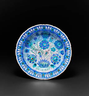 A LARGE ORIENTALIST IZNIK STYLE GLAZED POTTERY CHARGE, POSSIBLY FRENCH, 19TH CENTURY: A LARGE ORIENTALIST IZNIK STYLE GLAZED POTTERY CHARGE, POSSIBLY FRENCH, 19TH CENTURY&nbsp;  Diameter: 34.5cm&nbsp;