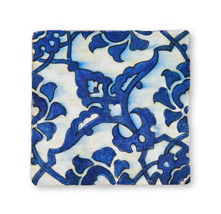 A BLUE AND WHITE ZNIK POTTERY TILE, OTTOMAN TURKEY, CIRCA 1600: A BLUE AND WHITE ZNIK POTTERY TILE, OTTOMAN TURKEY, CIRCA 1600 19.5. x 19cm 