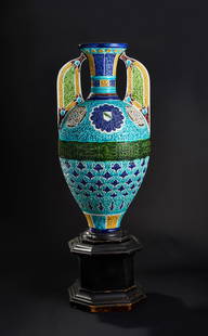 A LARGE ALHAMBRA STYLE VASE, SPAIN, 19TH CENTURY: A 19th-century Spanish vase, crafted in the Alhambra style, is a remarkable example of Moorish Revival ceramics. The amphora-shaped vessel features elaborate polychrome glazed decoration, with intrica