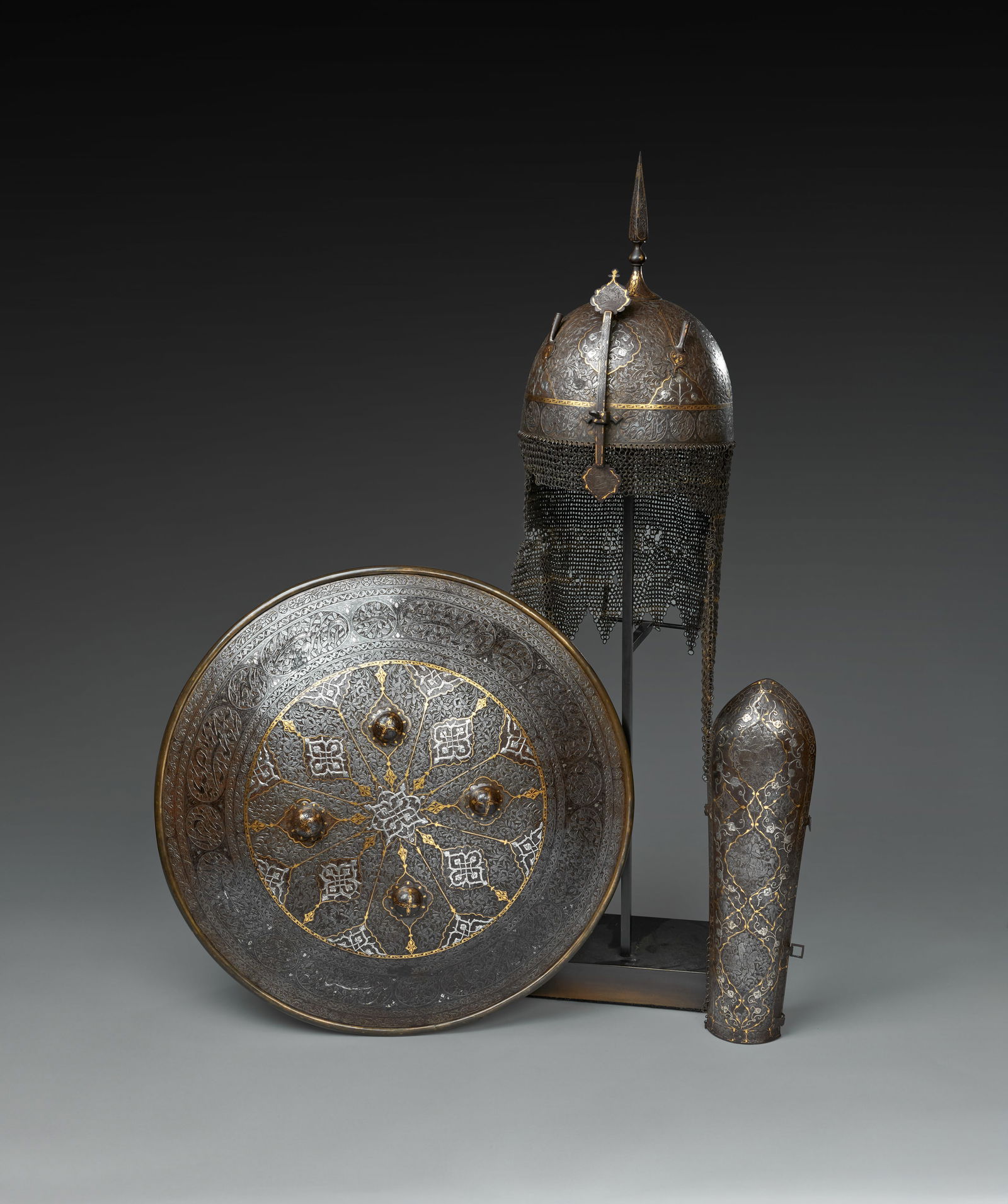 A SET OF QAJAR GOLD AND SILVER-DAMASCENED STEEL ARMOUR, PERSIA, 19TH CENTURY (1 of 8)