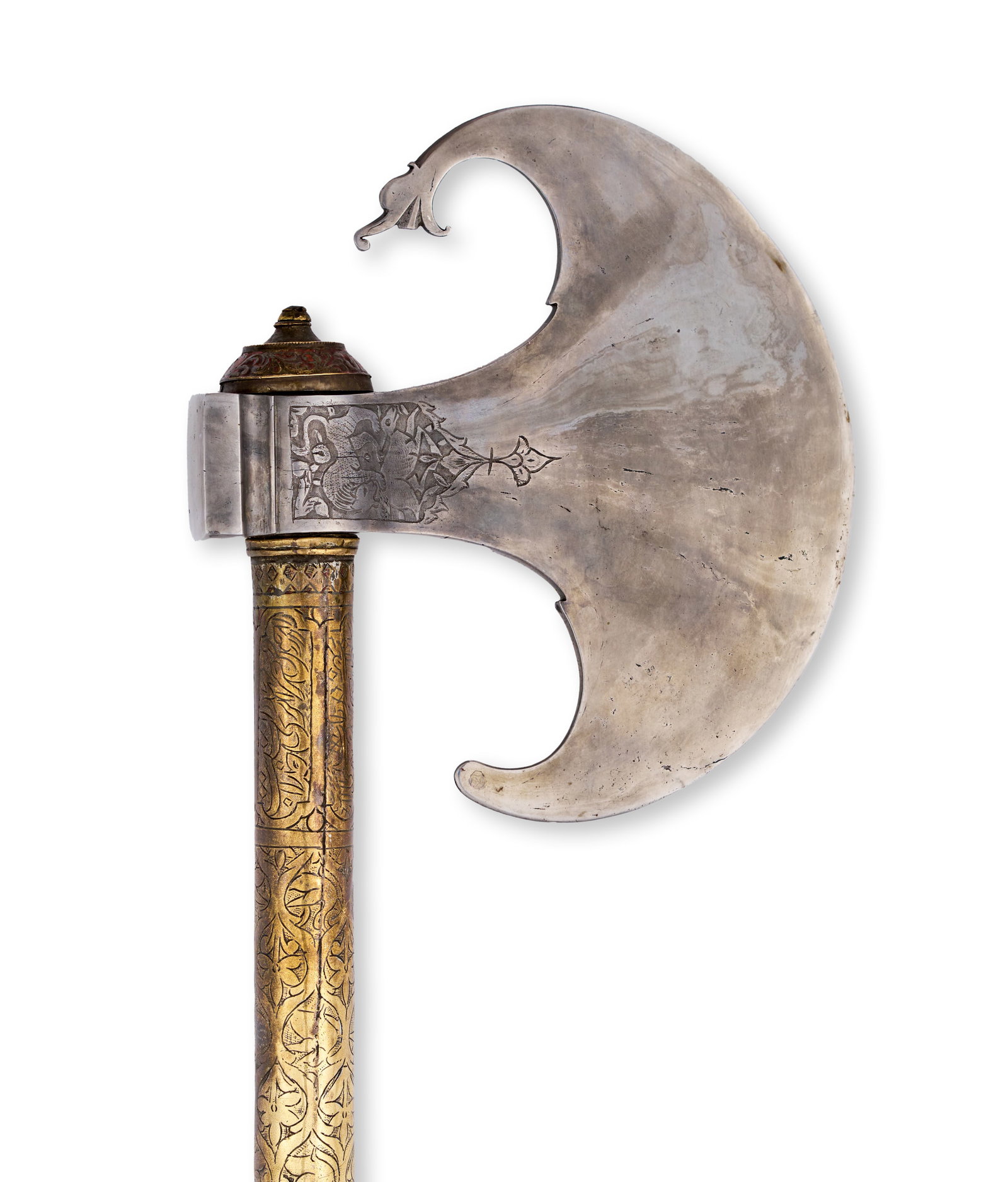A PERSIAN QAJAR CHISELLED STEEL AXE WITH ENGRAVED BRASS SHAFT, 19TH CENTURY: Featuring a large crescent-shaped steel blade with an upward-pointing spur and fine etched decoration. The axe head is mounted on a long cylindrical shaft, which is entirely covered in intricate gold