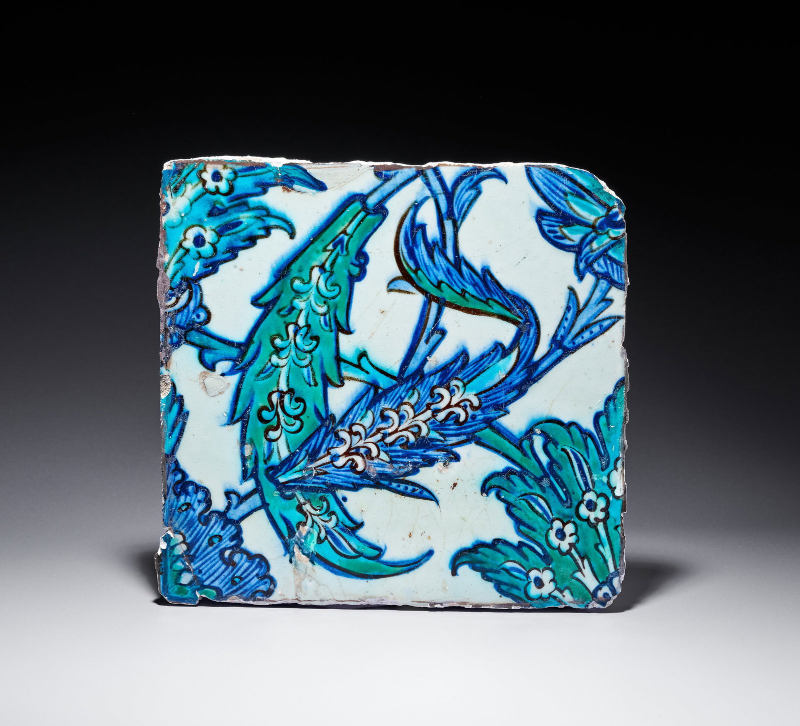 A DAMASCUS POTTERY TILE WITH SAZ LEAF DESIGN, OTTOMAN SYRIA, 16TH - 17TH CENTURY (1 of 3)