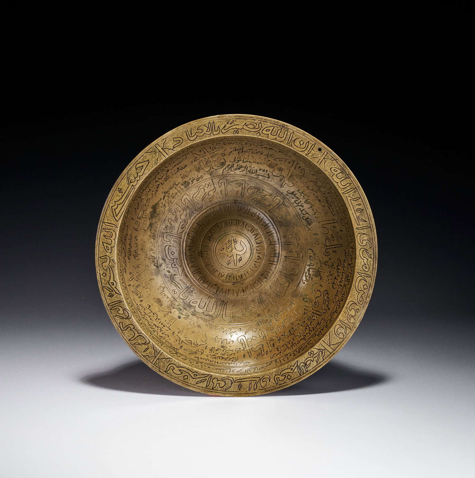 AN ENGRAVED BRASS MAGIC BOWL, INDIA DECCAN, 19TH CENTURY (1 of 4)