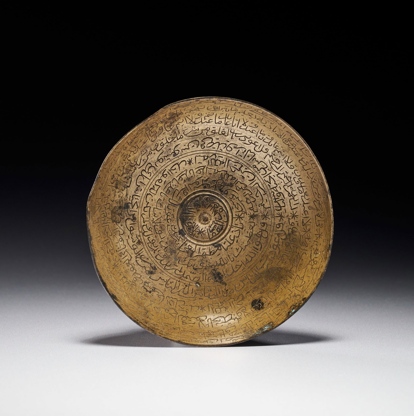 AN ISLAMIC ENGRAVED BRASS TALISMANIC MAGIC BOWL, INDIN, 18TH-19TH CENTURY (1 of 2)