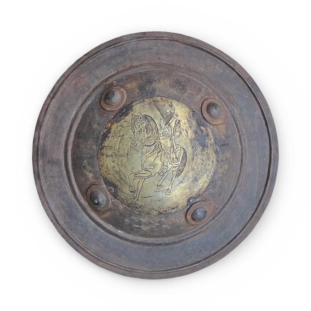 AN INDIAN STEEL DHAL DEPICTS RANJIT SINGH WITH GURMUKHI INSCRIPTION, NORTH INDIA, 19TH CENTURY (1 of 3)