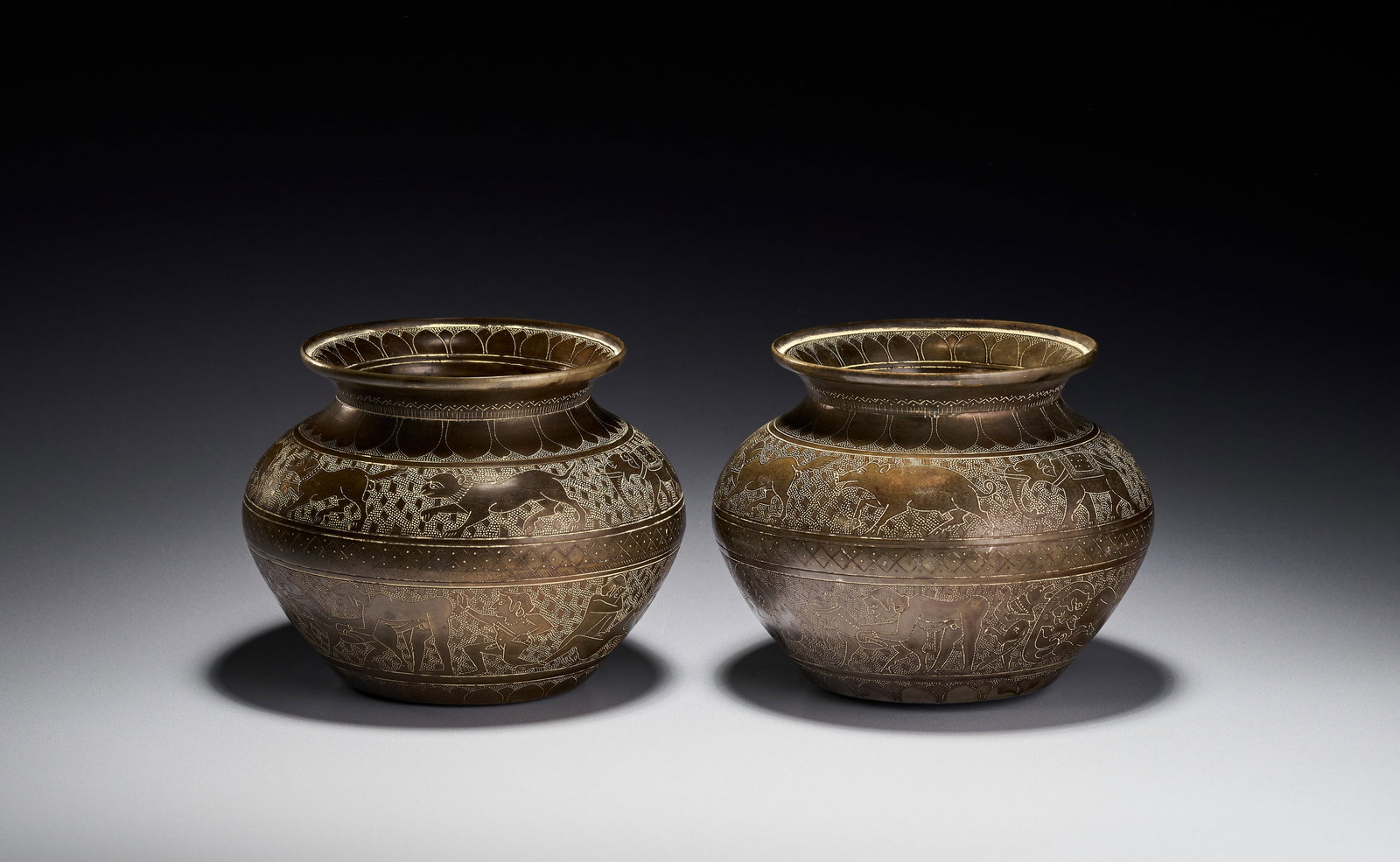 A PAIR OF EROTIC INDIAN ENGRAVED BRASS LOTA VESSELS BY P.L. BHARUCHA (1 of 6)