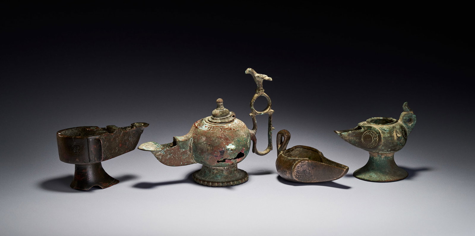A GROUP OF ISLAMIC BRONZE KHORASAN OIL LAMPS, IRAN, 12TH-13TH CENTURY (1 of 7)