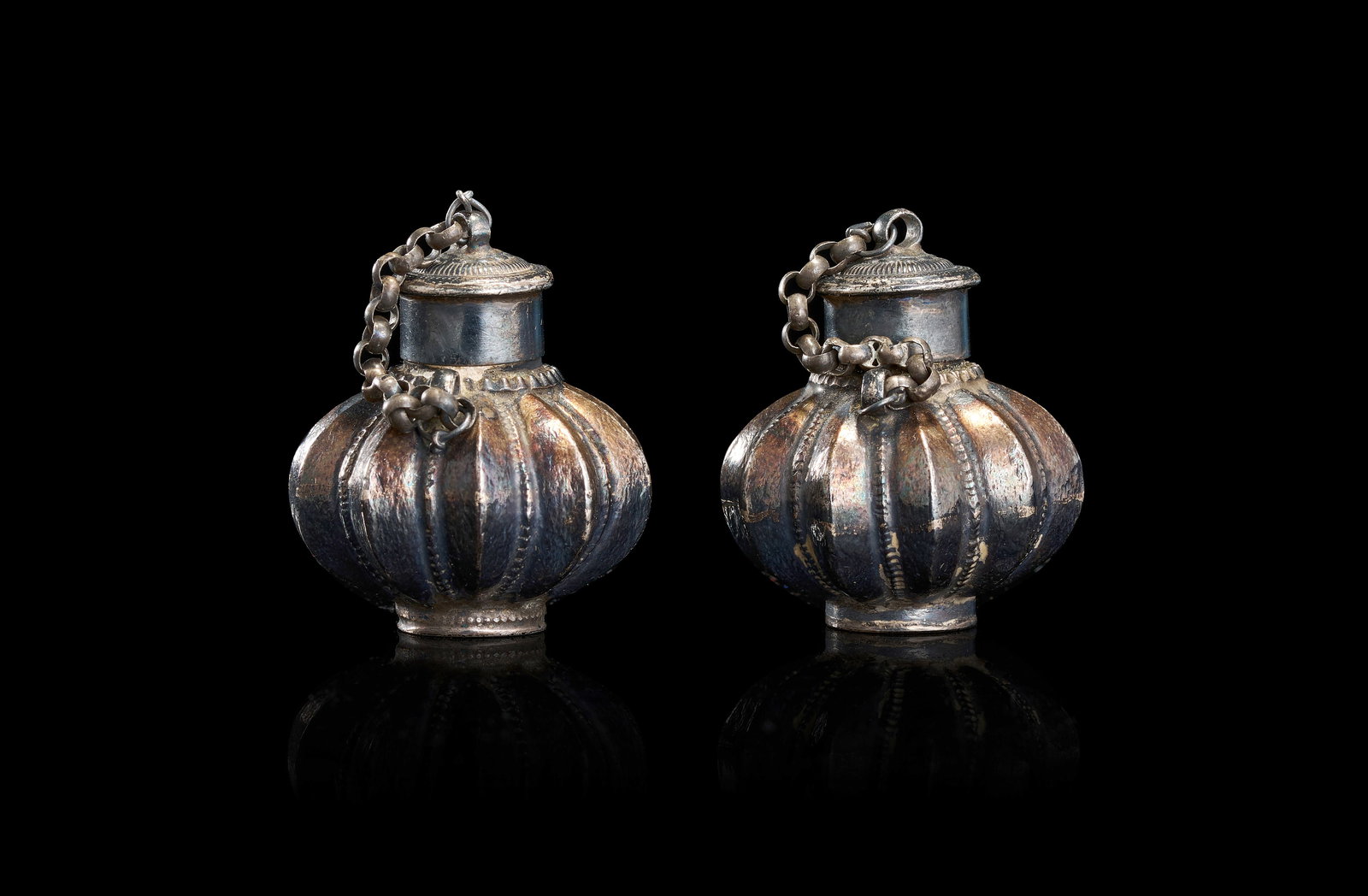 A PAIR OF SILVER-TONED MELON-FORM SCENT BOTTLES, INDIA, 19TH CENTURY (1 of 4)