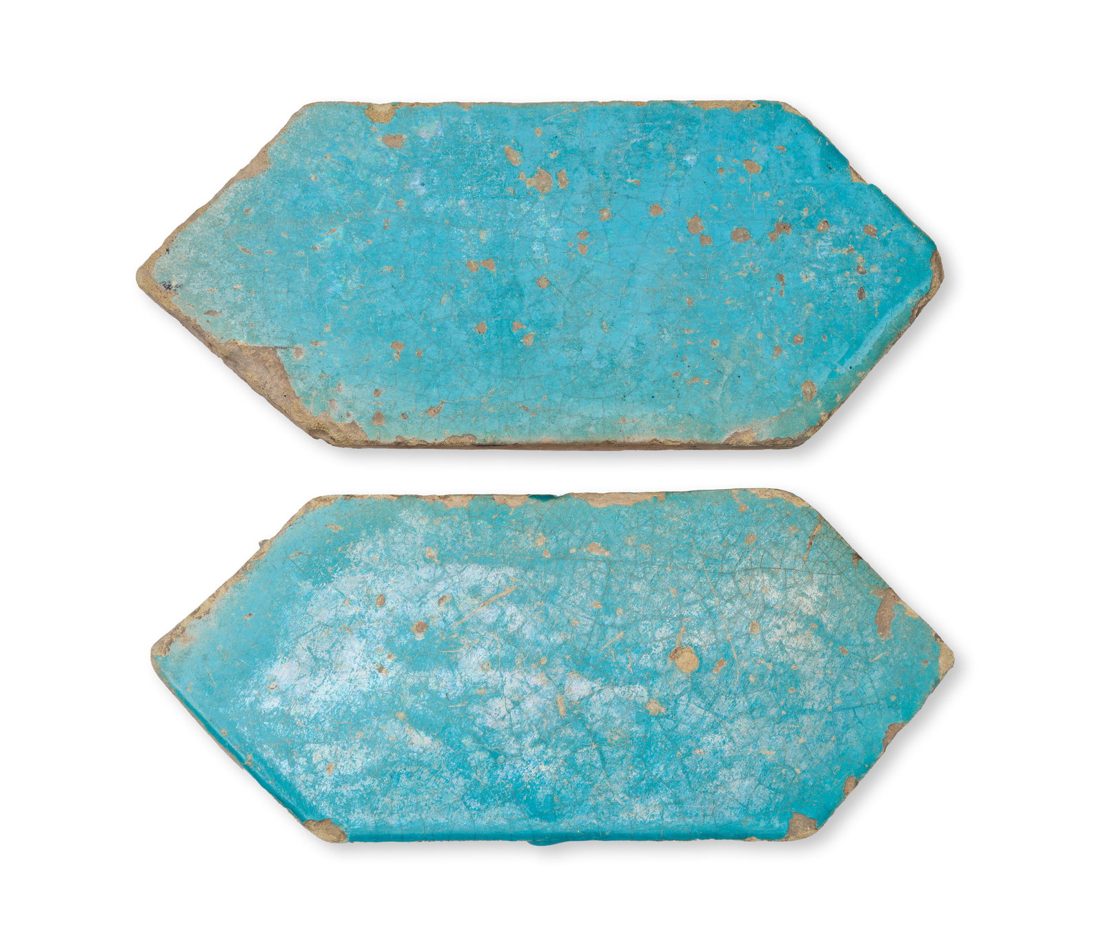 A PAIR OF KASAHN TURQUOISE GLAZED ELONGATED HEXAGONAL TILES, PERSIA, 12TH - 13TH CENTURY (1 of 2)