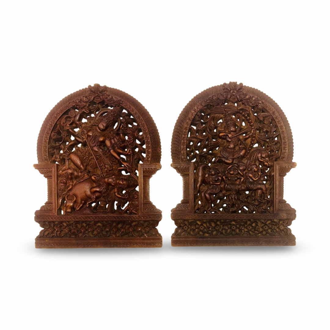 A PAIR OF SOUTH INDIAN CARVED WOOD PANELS DEPICTING MAHISHASURAMARDINI AND A HEROIC FIGURE ON: This pair of high-relief carved wood panels is characteristic of South Indian craftsmanship, likely from the Mysore region of Karnataka or Tamil Nadu, dating to the late 19th or early 20th century. Th