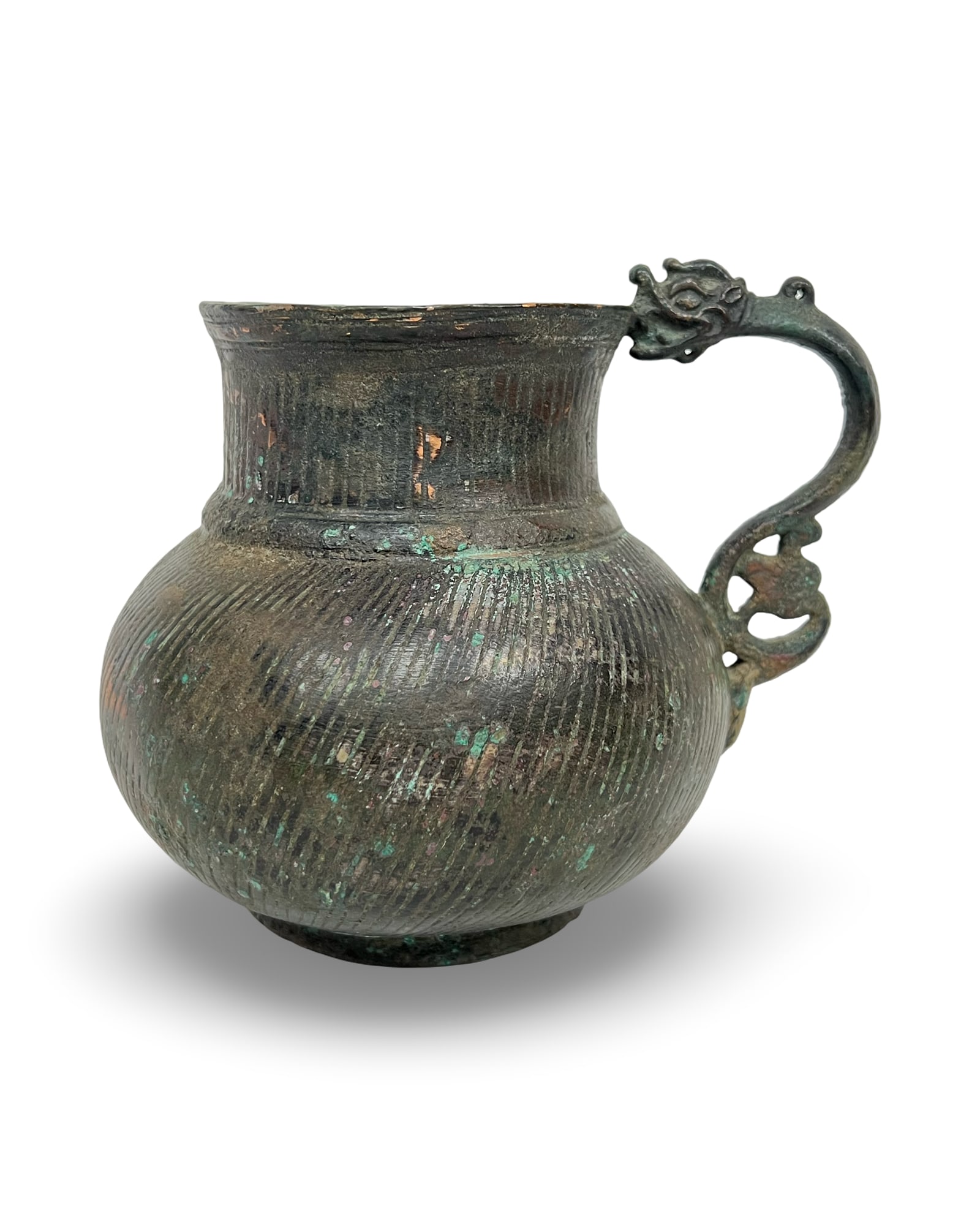 A TIMURID DRAGON-HANDLED JUG, CENTRAL ASIA, LATE 14TH-EARLY 15TH CENTURY: A Timurid cast bronze jug of Central Asian form, featuring a bulbous body and a flared neck. The exterior surface is decorated with fine, vertically-corded linear ribbing. The vessel is fitted with a 