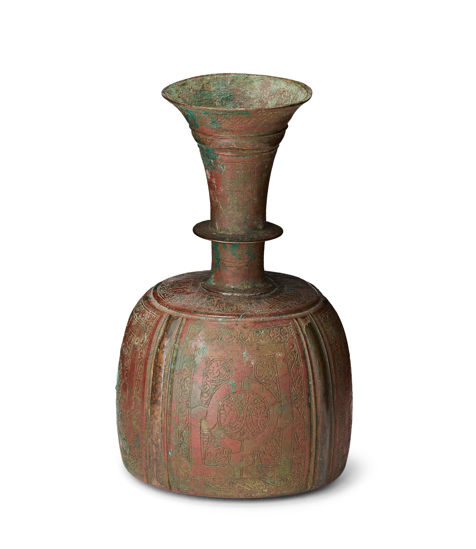 A SELJUK BRONZE FLUTED BOTTLE, POSSIBLY KHORASAN, 12TH - 13TH CENTURY: A cast bronze vessel with a bulbous fluted body and a tiered neck featuring a central horizontal flange and a flared, trumpet-shaped rim. The surface is intricately decorated with incised ornamentatio