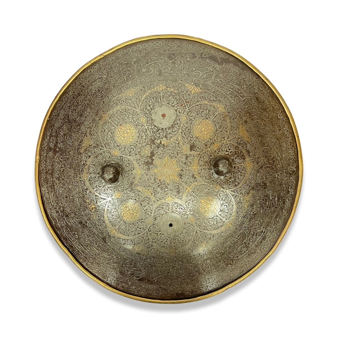 A QAJAR GOLD DAMASCENED STEEL SHIELD, PERSIA, 19TH CENTURY (1 of 2)