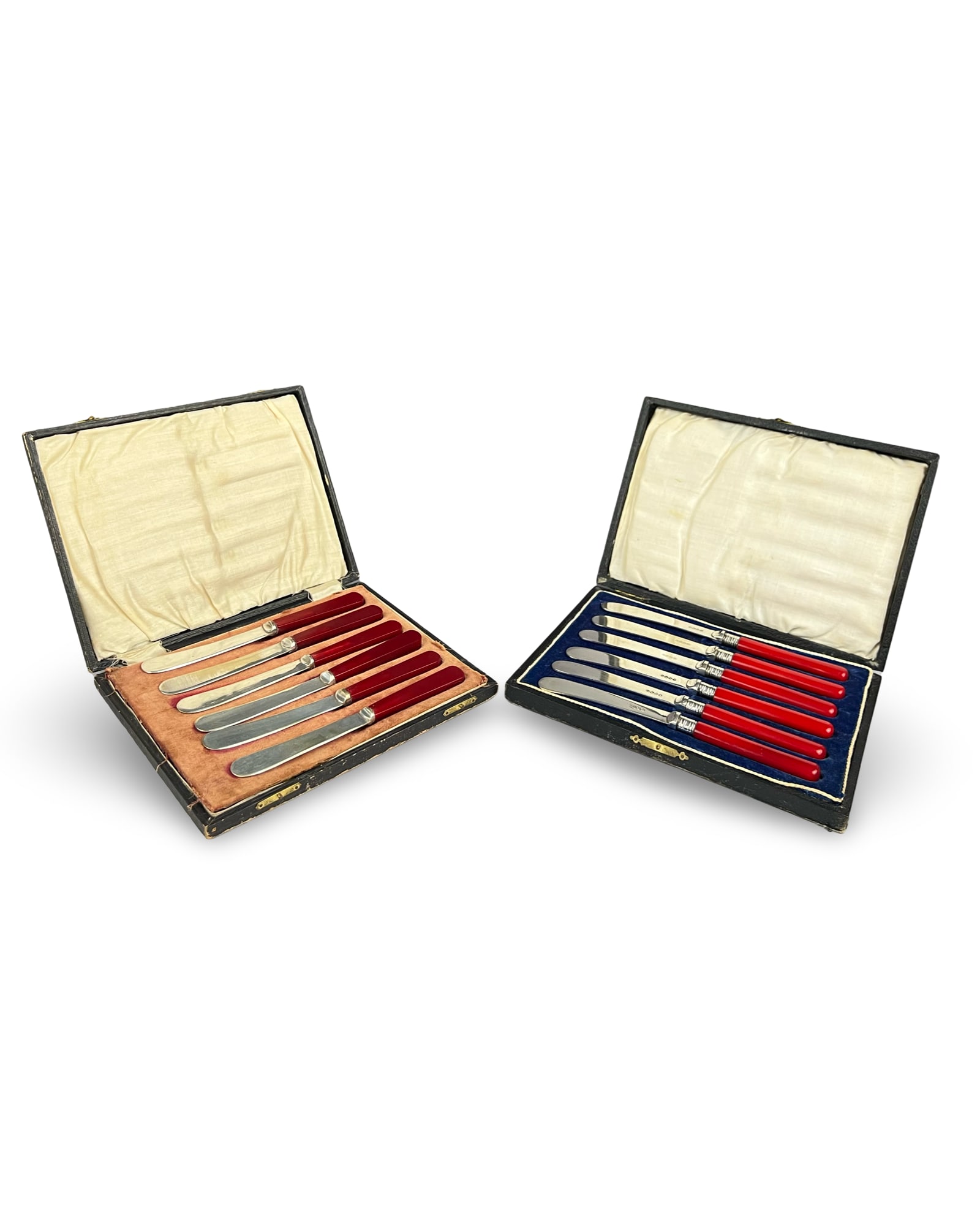 TWO CASED SETS OF ART DECO TEA KNIVES, PROBABLY CHERRY AMBER RED HANDLES: TWO CASED SETS OF ART DECO TEA KNIVES, PROBABLY CHERRY AMBER RED HANDLES Two cased sets of Art Deco period tea knives featuring cherry red composition handles. The first set consists of six knives wit