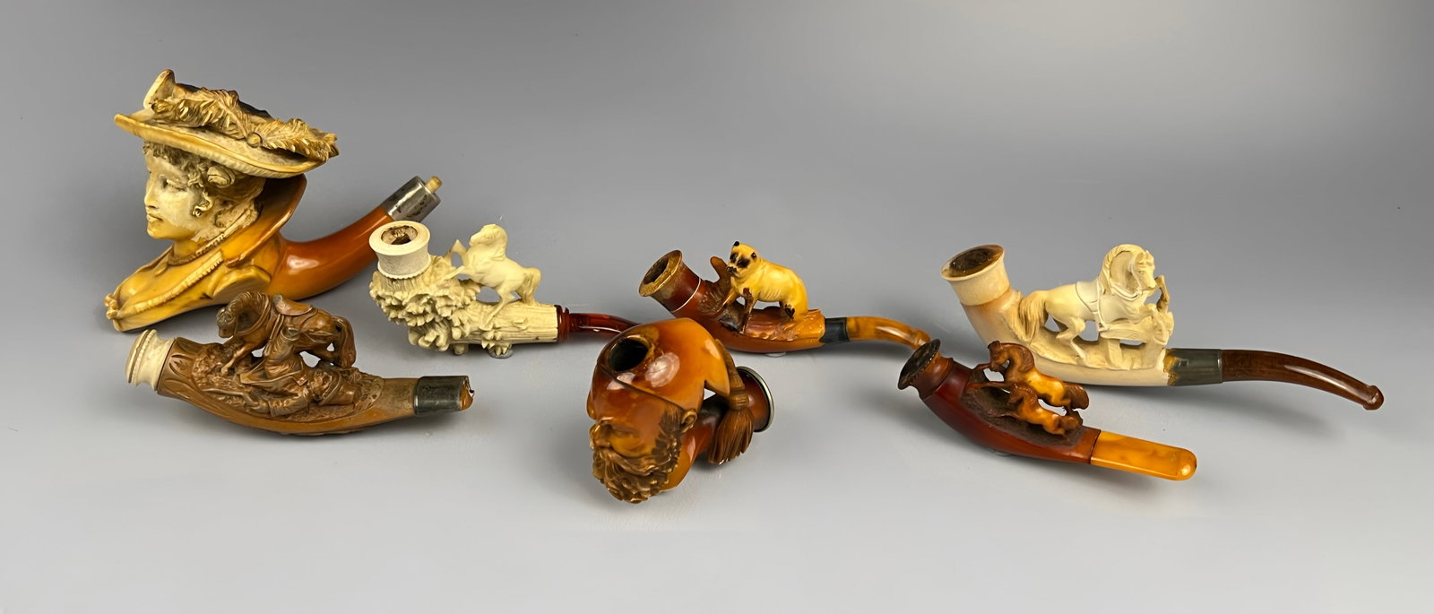 A COLLECTION OF VICTORIAN AND EDWARDIAN FIGURAL CARVED MEERSCHAUM SMOKING PIPES (1 of 6)