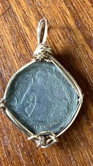 ANTIQUE 14KT YELLOW WIRE WRAPPED COIN: Total weight of the piece is 3 grams we cannot determine origin of the coin
