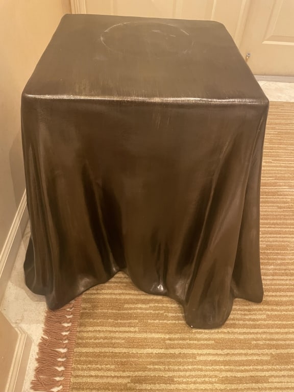 BRONZE DRAPED SIDE TABLE MANNER OF JOHN DICKINSON: Mid century table in the manner of Dickinson, measures 25" tallX 25" wideX 25" in length. in great condition, over cement’ plaster. We searched and there id no Dickinson signature, although it lookd