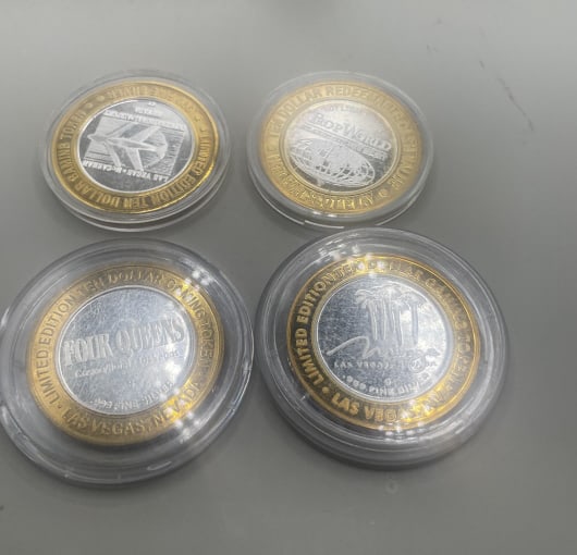 (4) TEN DOLLAR .999 SILVER VEGAS CASINO CHIPS: to inc; TROP WORLD, FOUR QUEENS,MIRAGE,MCLARREEN AIRPORT SLOTS All in excellent condition, in plAstic cases, marked .999 fine silver