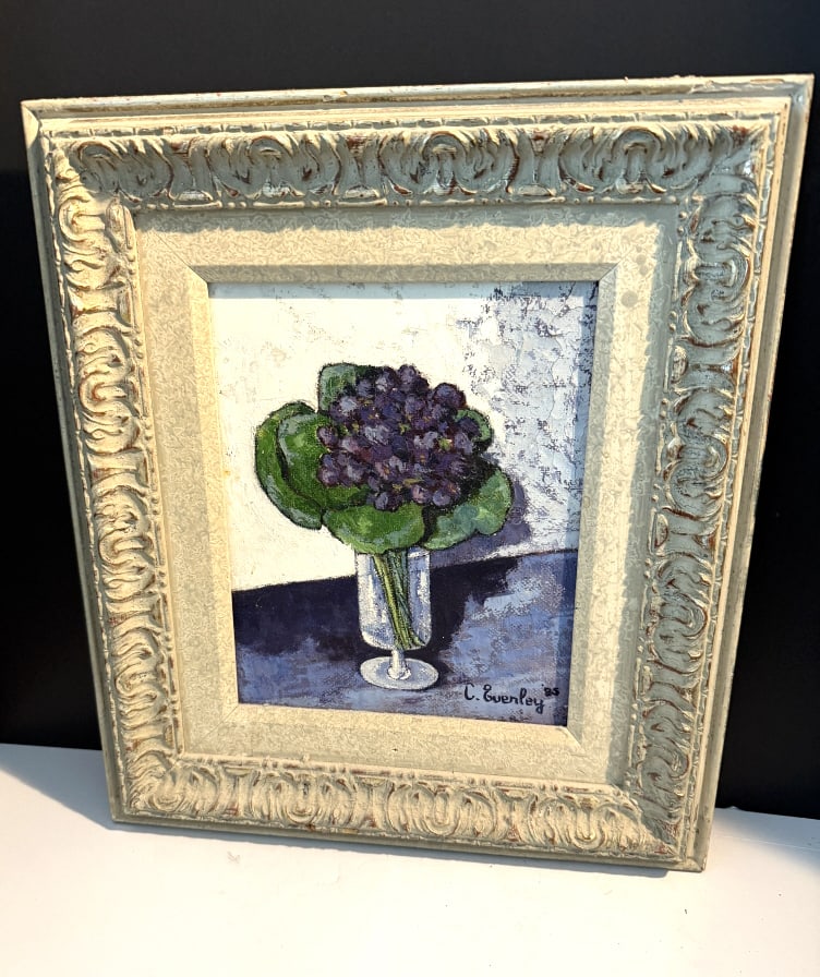 CECIL EVERLEY FR.AM VIOLET FLOWERS VASE 1910-1989: Oil on canvas, signed lower right dated 1985 measures 7" X 9 1/2" Artist and bon vivant Cecil Everley painted the landscapes surrounding his homes in California and the south of France. Everly began p