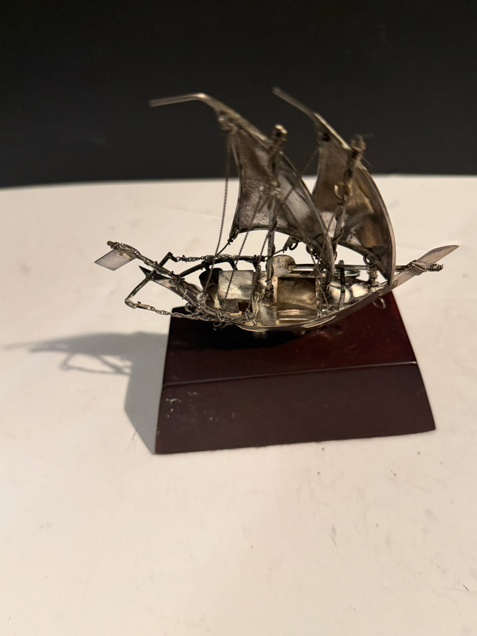 STERLING SCHOONER ON WOODEN BASE: About 5” tall and 5” wide weighs several ozt