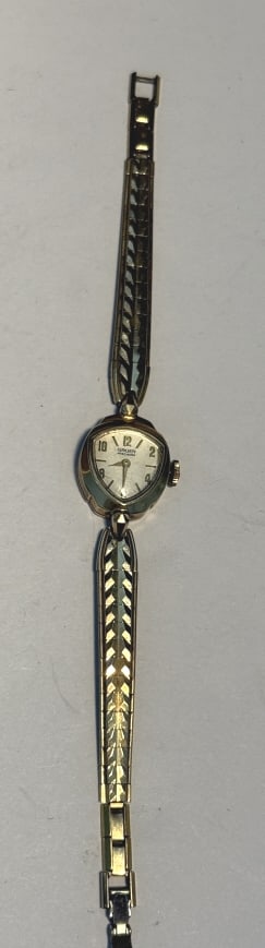 14KT Y.G. GRUEN MID CENTURY COCTAIL WATCH: Has a distinctive cat-eye shaped case which was popular for womens watches of the era. the case is marked 14kt , manual winding