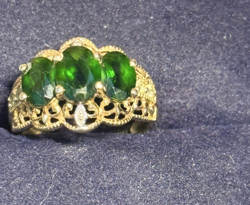 10 KT YELLOW GOLD TSVORITE & DIAMOND LADIES RING: Size 6, with 3 oval tsvorite stones accented with small round diamonds, total weight 2.1 dwt