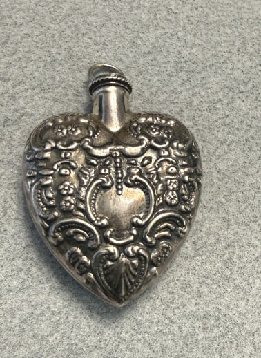 VICTORIAN STERLING SILVER REPOUSSE PERFUME PENDANT: HT OF 2 1/4" to inc the bail, width of 1 1/2"