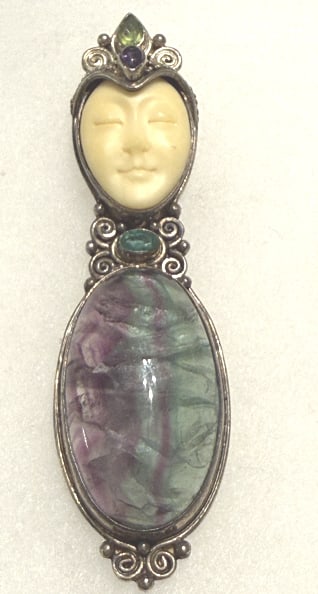 VTG SAJEN STERLING PENDANT CARVED GODDESS FACE: About 2 1/2" long, with peridot stone in the crown, large rainbow flourite gemstone note cracked, and amethyst stone at neck