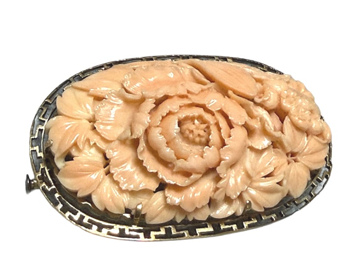 LARGE CORAL FLORAL CARVED BROOCH IN 14KT Y. GOLD: About 2 1/2" in length, vintage carved angel skin coral, in a obidome peony carving, property of a Miami Beach ambassadors wife, in fine condition total weight 20.4 dwt