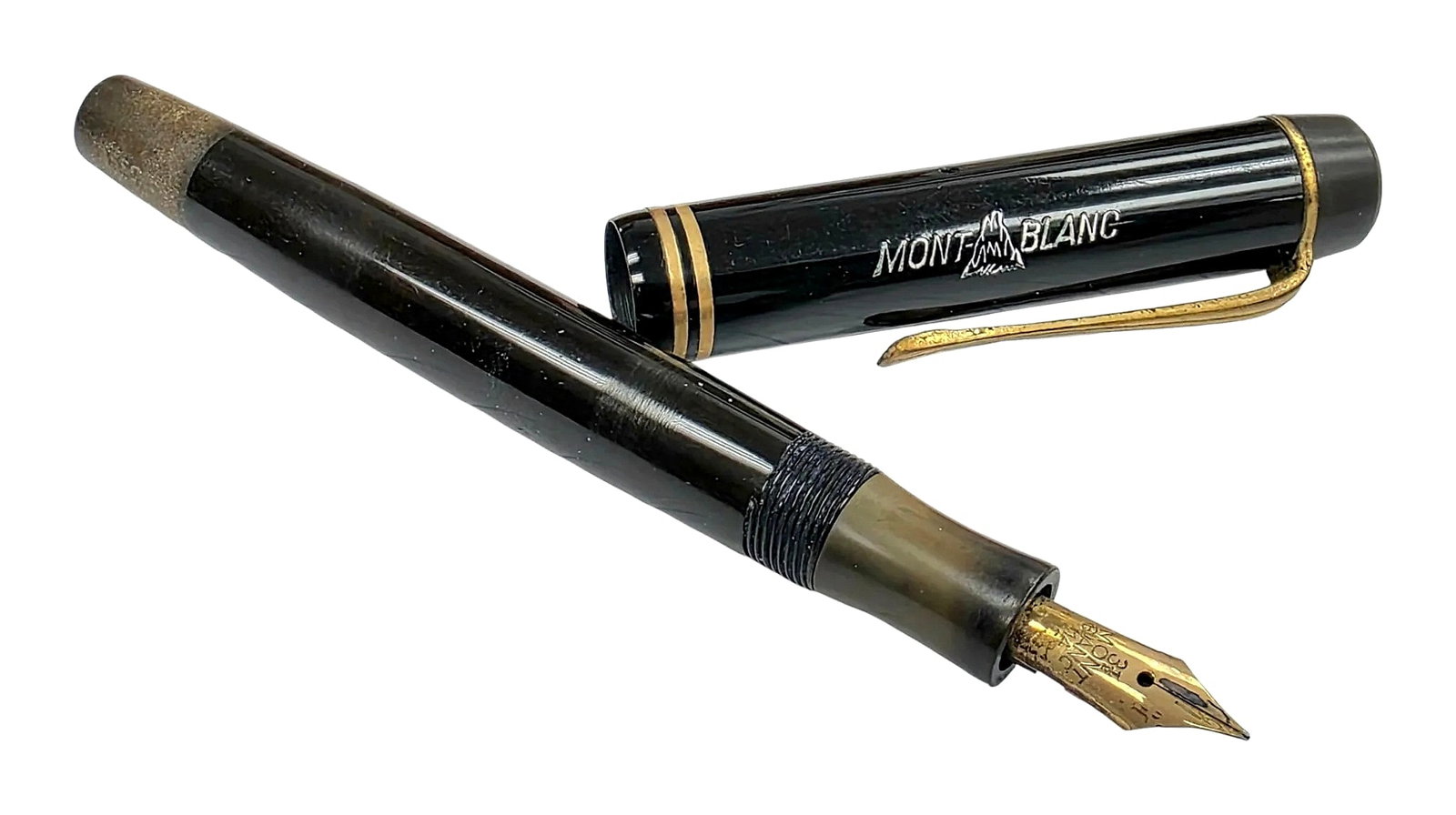 Montblanc Vintage Black Fountain Pen with 14K Gold Nib: A vintage Montblanc fountain pen. The black cap features the engraved "MONTBLANC" lettering framing the mountain outline logo, double gold-tone cap rings, a gold-tone pocket clip, and the signature wh