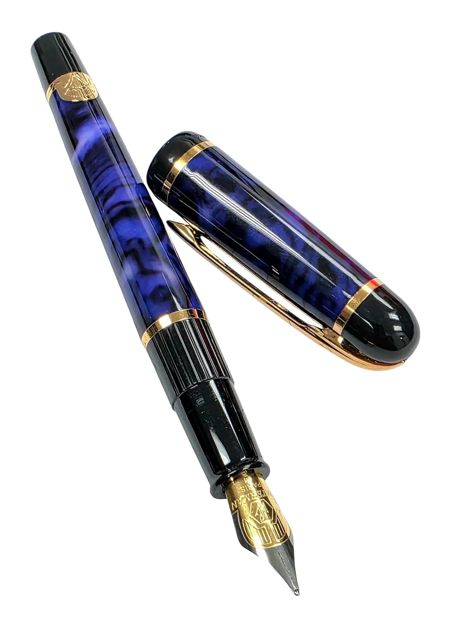 Waterman Philéas Blue Marble Fountain Pen: Waterman Philéas fountain pen featuring a blue marbled finish with gloss black accents and gold-tone trim. The cap is fitted with a gold-tone clip bearing the Waterman logo, dual gold-tone accent