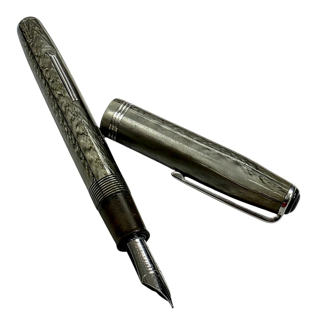 Vintage Esterbrook Grey Marbled Lever-Fill Fountain Pen: A vintage Esterbrook lever-filler fountain pen featuring a grey marbled finish throughout the barrel and cap. The cap is fitted with a ribbed pocket clip stamped "ESTERBROOK", dual engraved cap