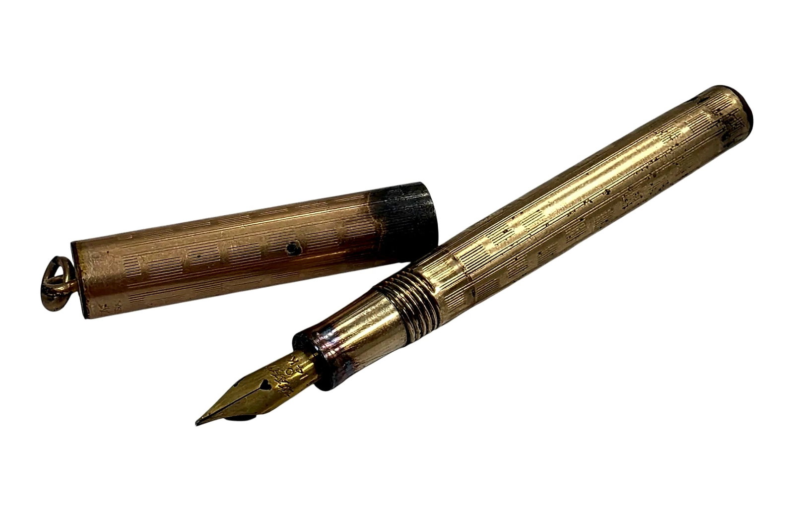Vintage Wahl Gold-Filled Ring-Top Fountain Pen with 14K Gold Nib: A vintage Wahl ring-top fountain pen featuring an engine-turned gold-filled cap and barrel with a 14K gold nib. The cap end includes a suspension ring and is stamped 'WAHL PEN MADE IN U.S.A.'