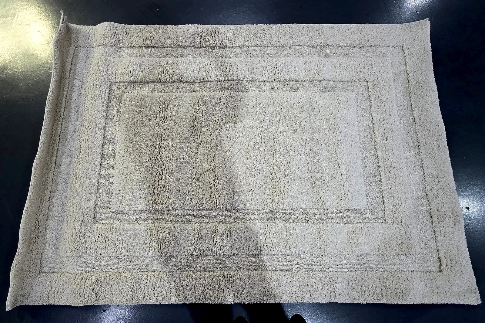 Safavieh Florida Shag Cream Area Rug SG454-1111, 5'3" x 7'6": A Safavieh area rug from the Florida Shag collection, featuring a tonal rectangular border pattern with a sculptured high-low pile. The reverse retains the original manufacturer label identifying