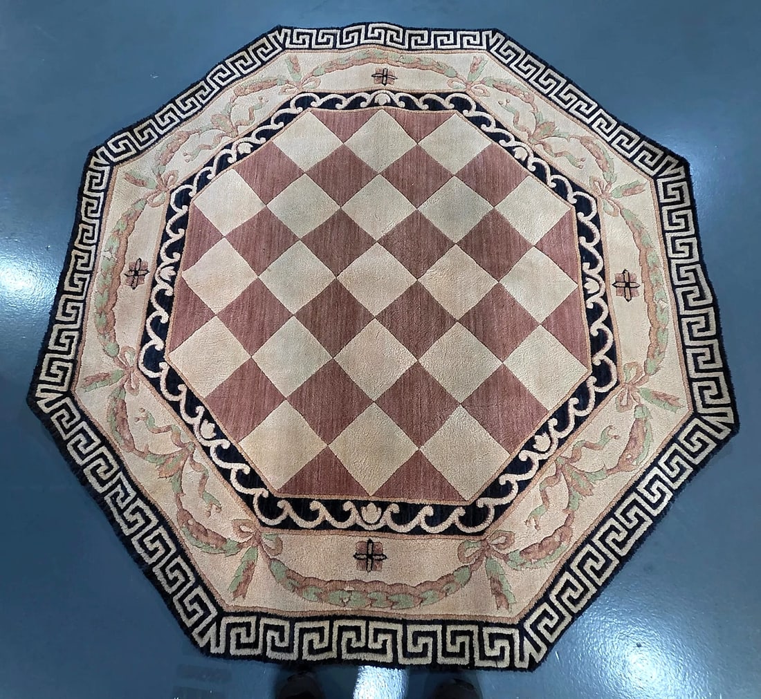 Neoclassical Style Octagonal Rug with Greek Key Border: An octagonal area rug featuring a neoclassical design scheme. The central octagonal medallion is decorated with a diagonal diamond checkerboard pattern in muted dusty rose and cream tones. This