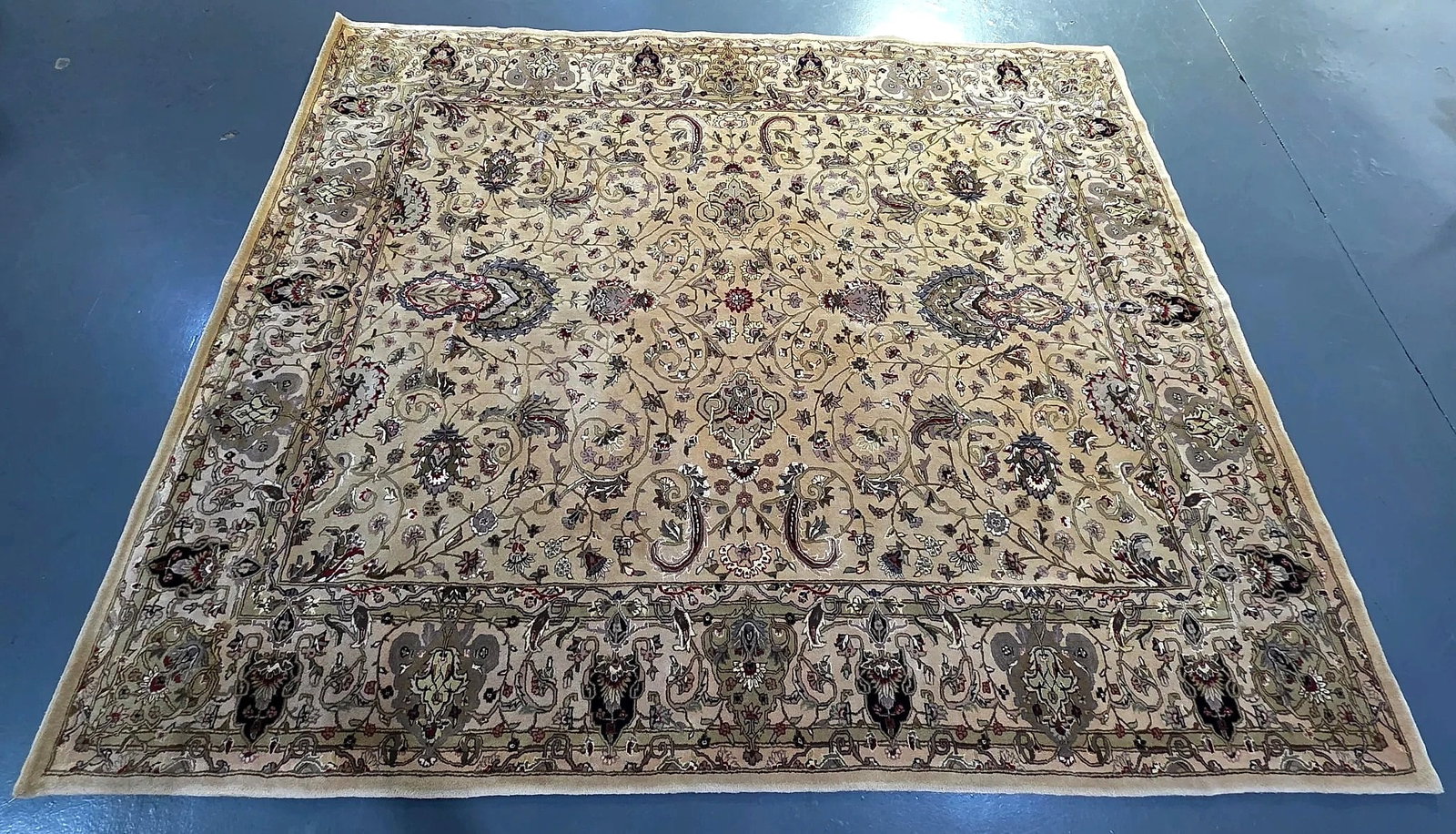 Persian Style Floral Arabesque Pattern Area Rug: An area rug decorated in an all-over traditional Persian style. The main field features a dense composition of floral palmettes, blossoming motifs, scrolling leafy vines, and arabesque flourishes,