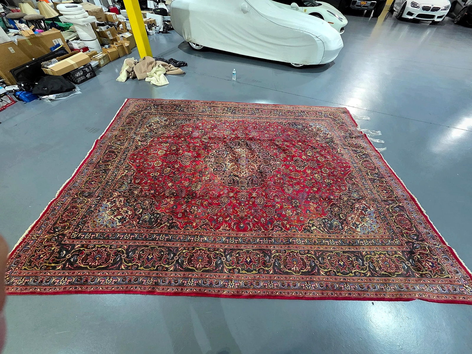 Persian Mashad Hand-Knotted Large Carpet (388 x 297 cm): A large hand-knotted Persian Mashad area carpet originating from Iran. The design features a rich red central field decorated with an intricate multi-lobed floral medallion, surrounded by dense scroll