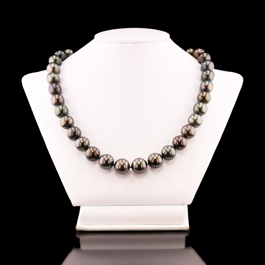 11MM to 13MM Tahitian Cultured Pearl Necklace with 14K White Gold Clasp (GIA CERTIFIED): One GIA certified single strand Cultured Tahitian Pearl necklace. The strand has each pearl individually hand knotted and is finished With a 14K white gold plunger style tension locking scalloped bead