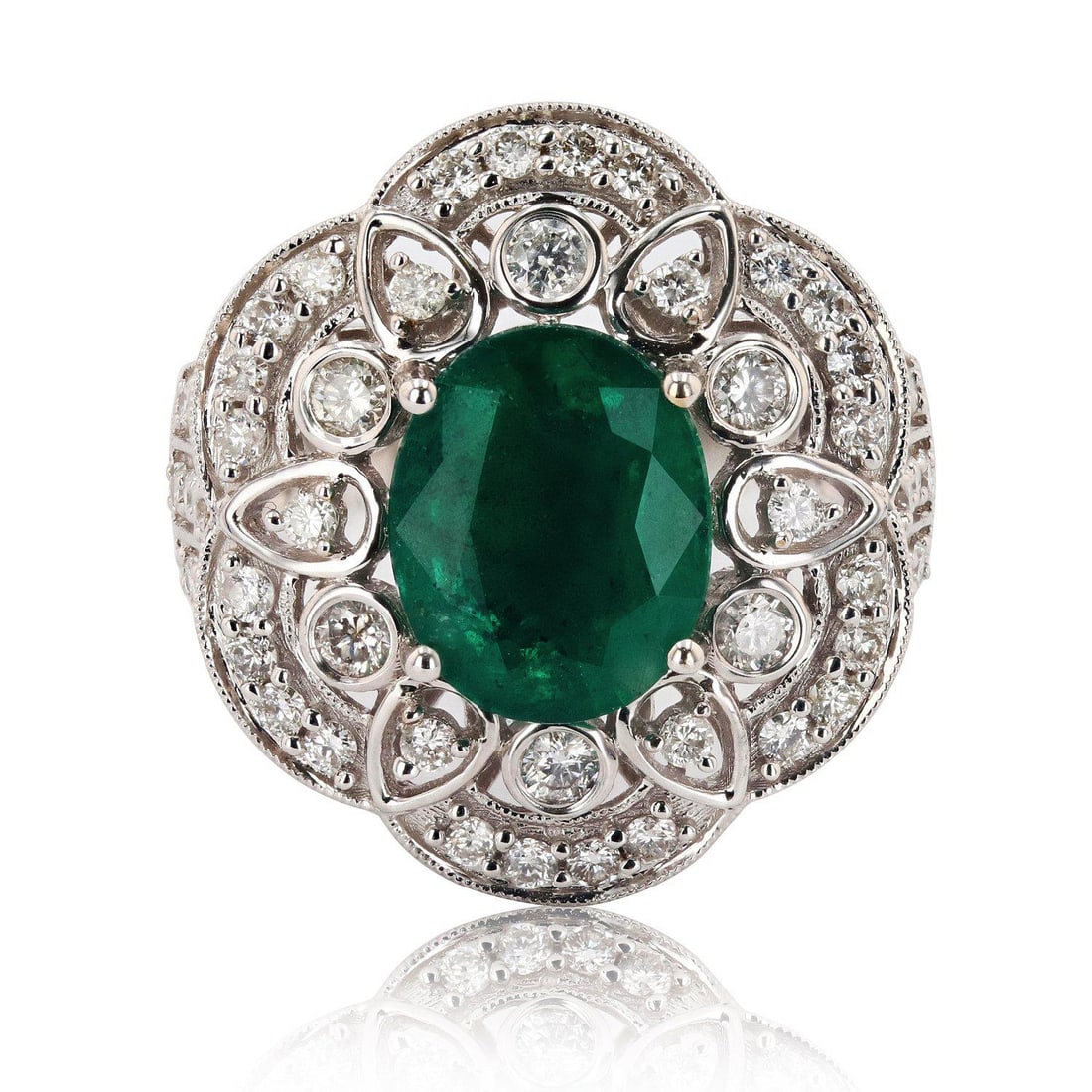 2.78ct Emerald and 0.97ctw Diamond 18K White Gold Ring: One electronically tested 18KT white gold ladies cast and assembled emerald and diamond ring. Condition is new, good workmanship. The featured emerald is set within an inner basket and outer diamond f