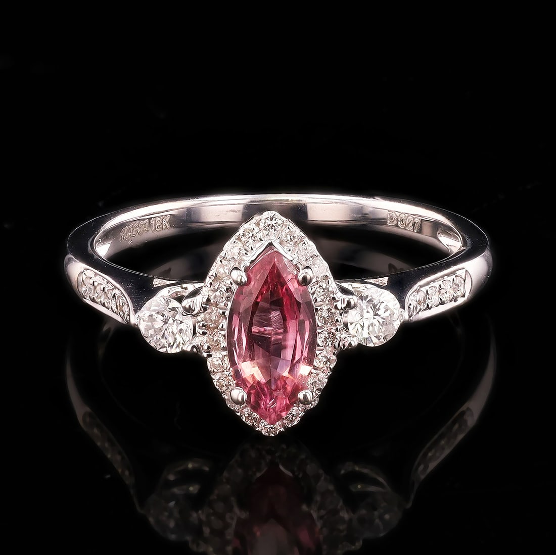0.81ct Brownish Pink Sri Lanka Sapphire and Diamond 18K White Gold Ring: Set in an 18 Kt. white gold ring mounting with Diamonds on the sides is one marquise cut Natural Sapphire, approx. 0.81 ct. (9.17 x 4.33 x 2.40mm.), medium brownish-pink color, lightly included, good 