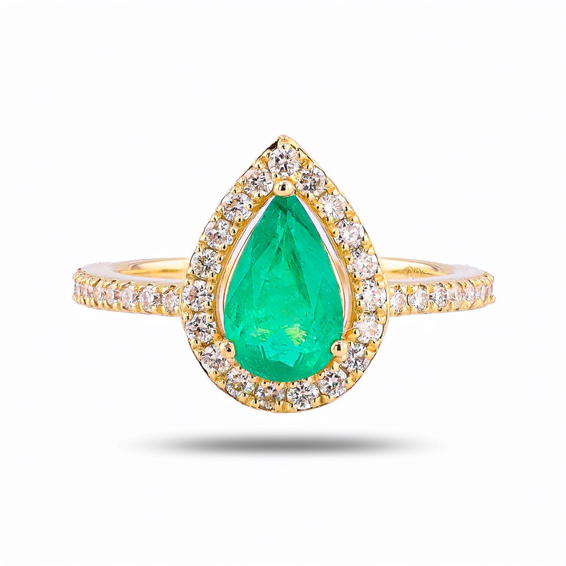 1.18ct Emerald and 0.44ctw Diamond 14K Yellow Gold Ring: One polished, stamped, and tested 14K yellow gold ring with a bright finish. The ring is mounted with: 1 genuine emerald center stone weighing approximately 1.18 carat, and 35 genuine round diamonds w