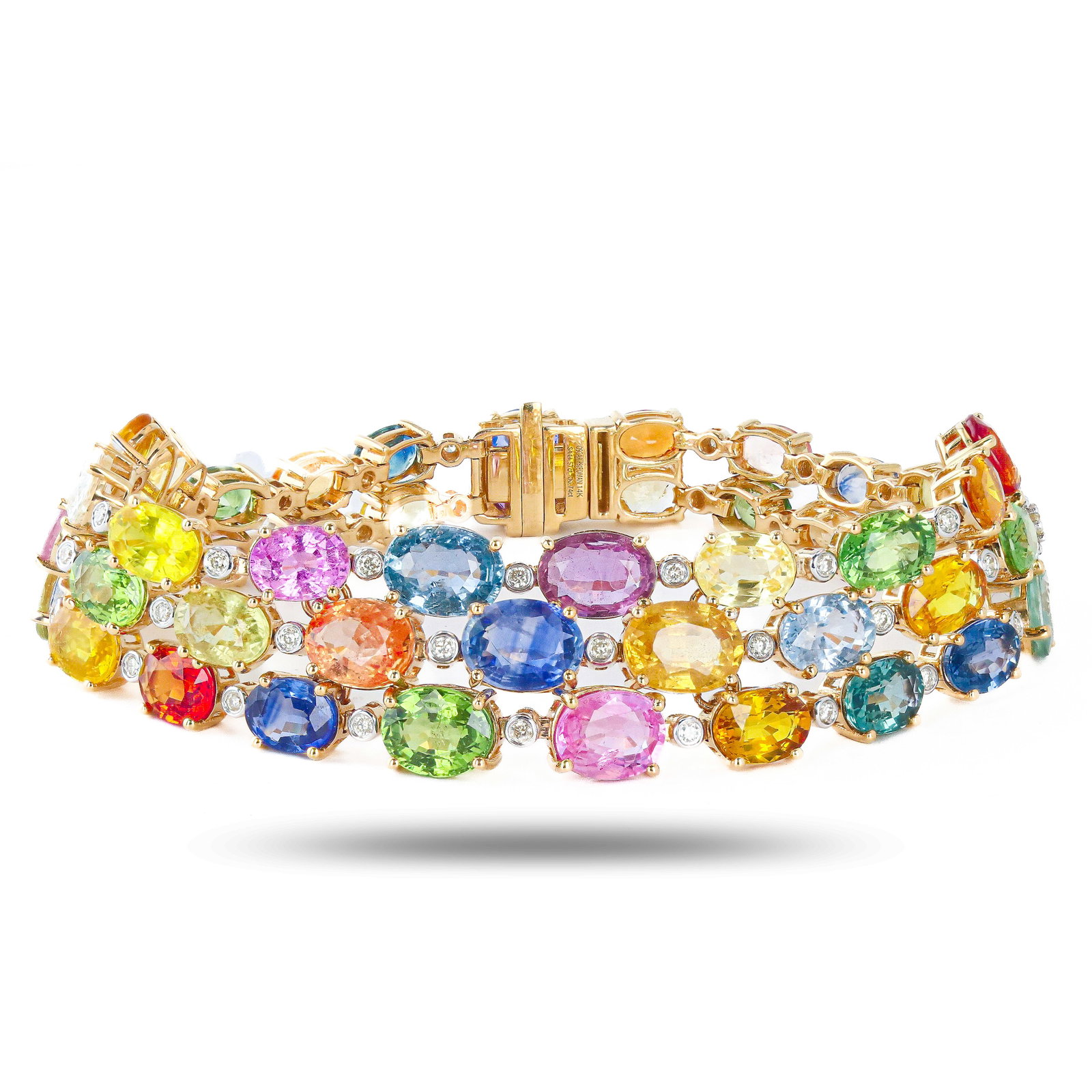44.57ctw MultiColor Sapphire and 0.74ctw Diamond 14K Yellow Gold Bracelet: Fourteen karat (14K) yellow gold natural multi color sapphire corundum and diamond bracelet. Oval brilliant cut natural multi color sapphire corundum gemstones are mounted in the center of the bracele
