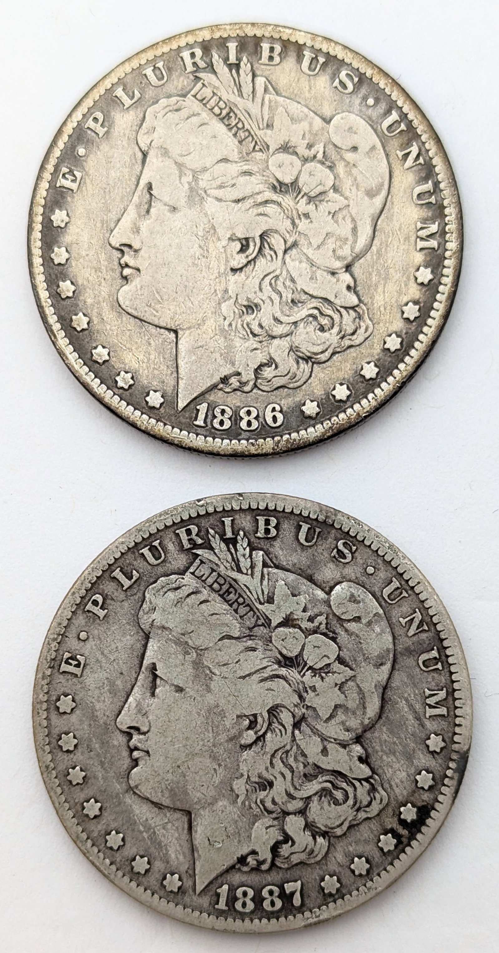 Lot of 2 Morgan Silver Dollar - 1886-O, 1887-O: Silver