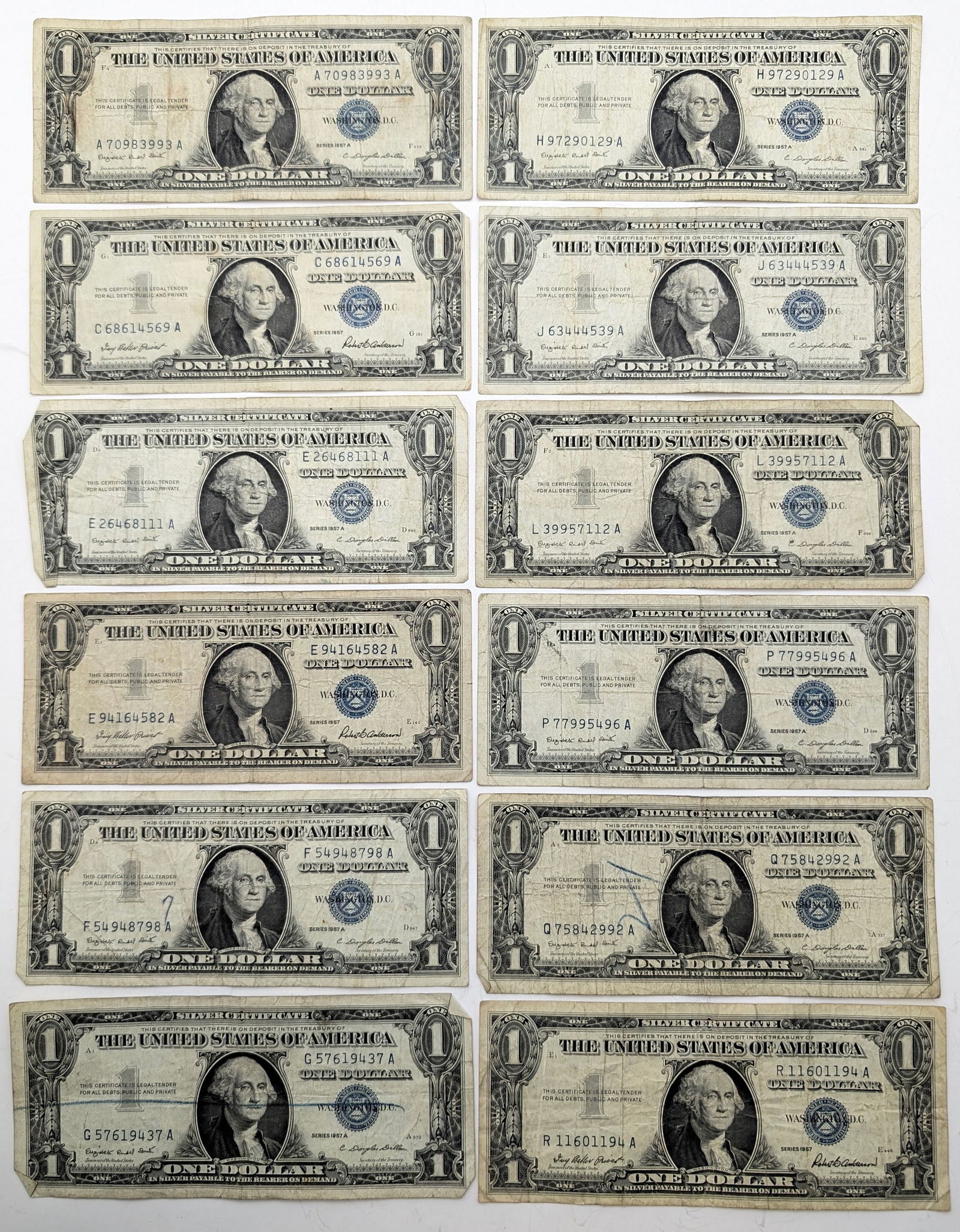 Lot of 12 - 1957 $1 Notes - Silver Certificates: Heavily Circulated Condition