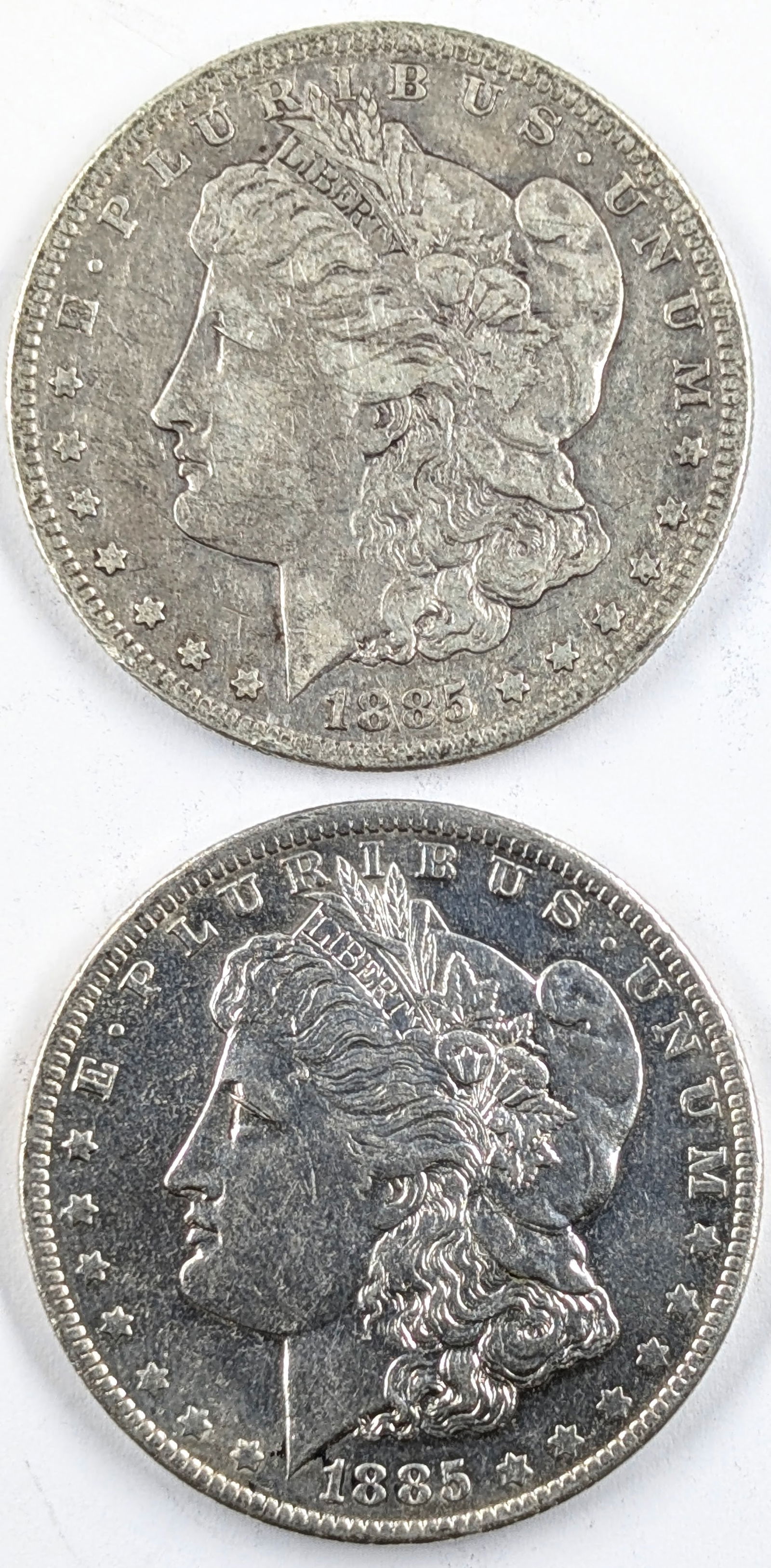 Lot of 2 Morgan Silver Dollar- 1885 S&O (1 of 2)