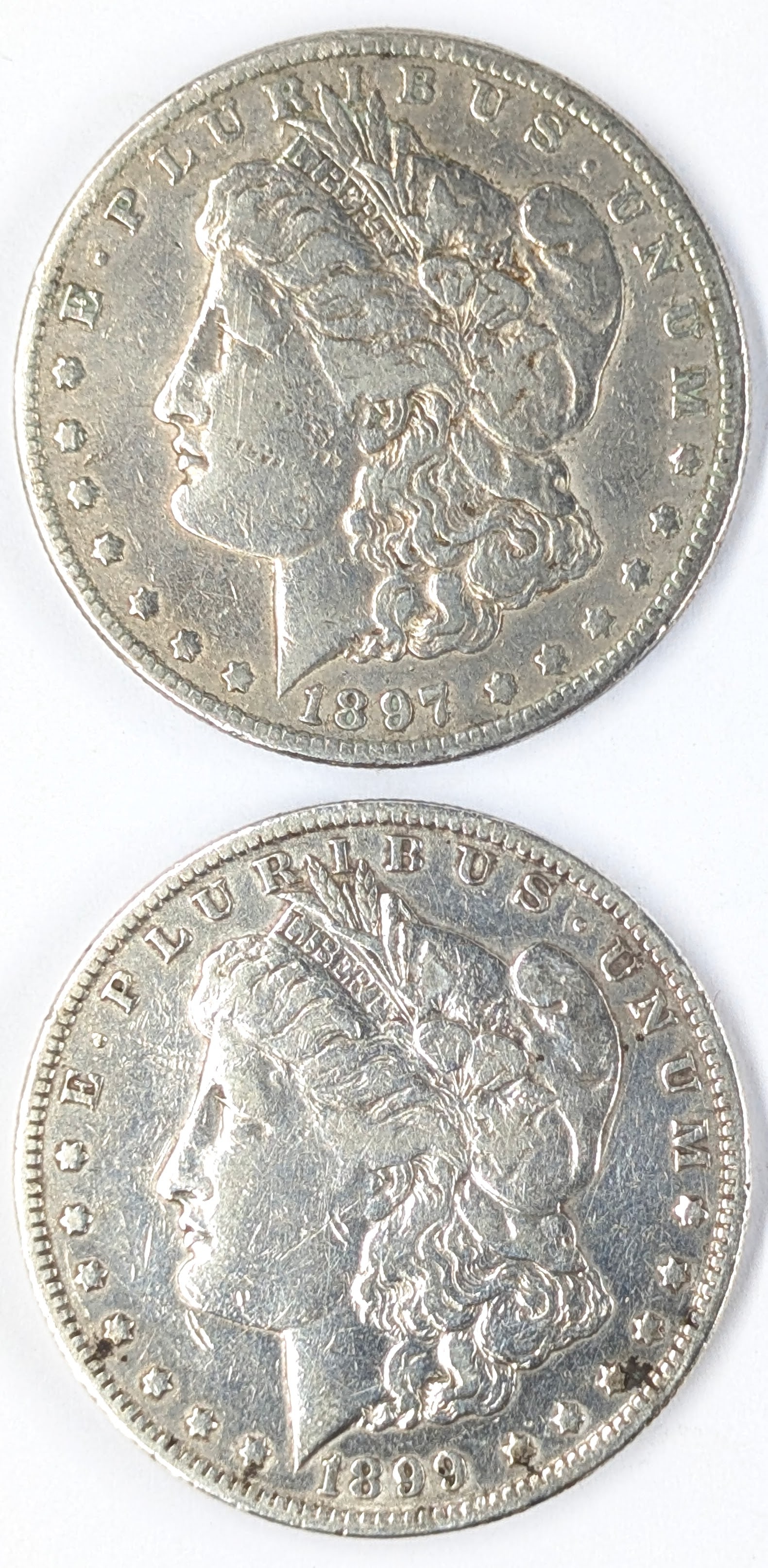 Lot of 2 Morgan Silver Dollars - 1897-O, 1899-O (1 of 2)