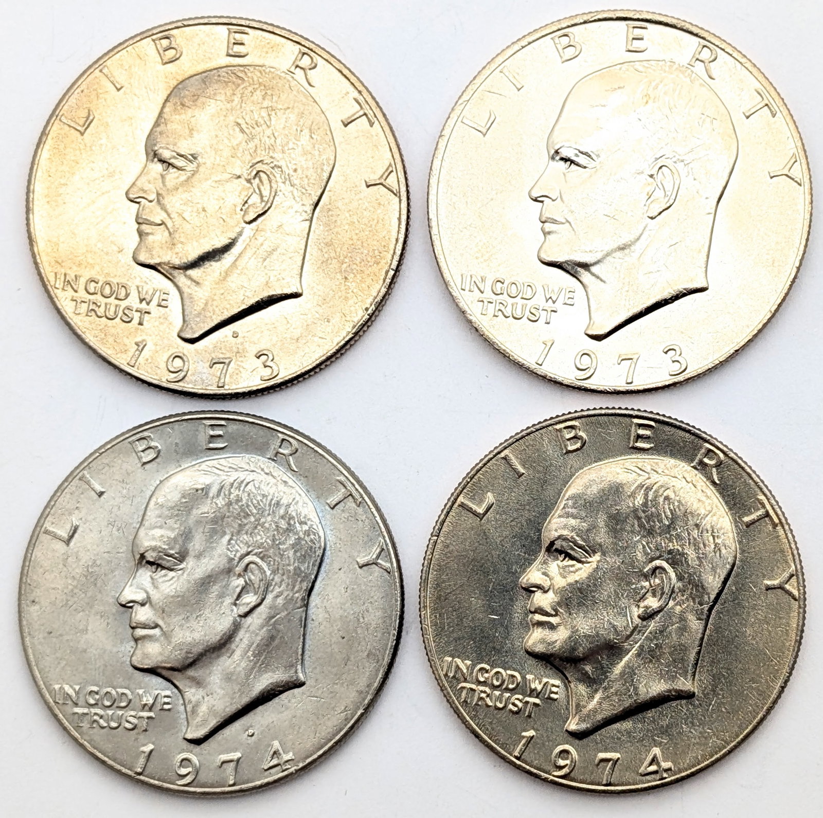 Lot of 4 Uncirculated Eisenhower "Ike" Dollars - 1973-1974 - Some Toned (1 of 2)