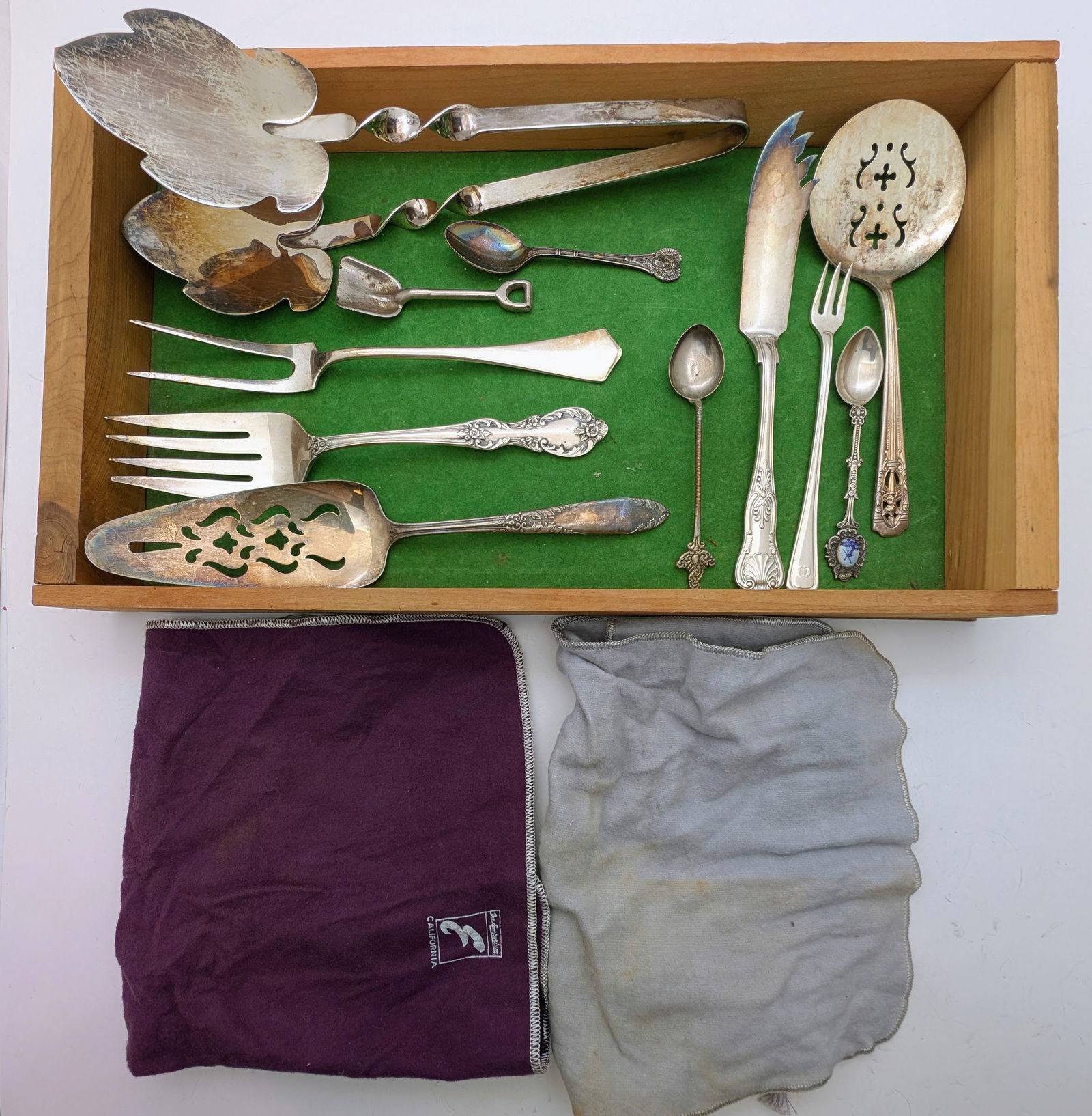 Assorted lot of Silver Plated Flatware Pieces plus two felt storage bags: _ 