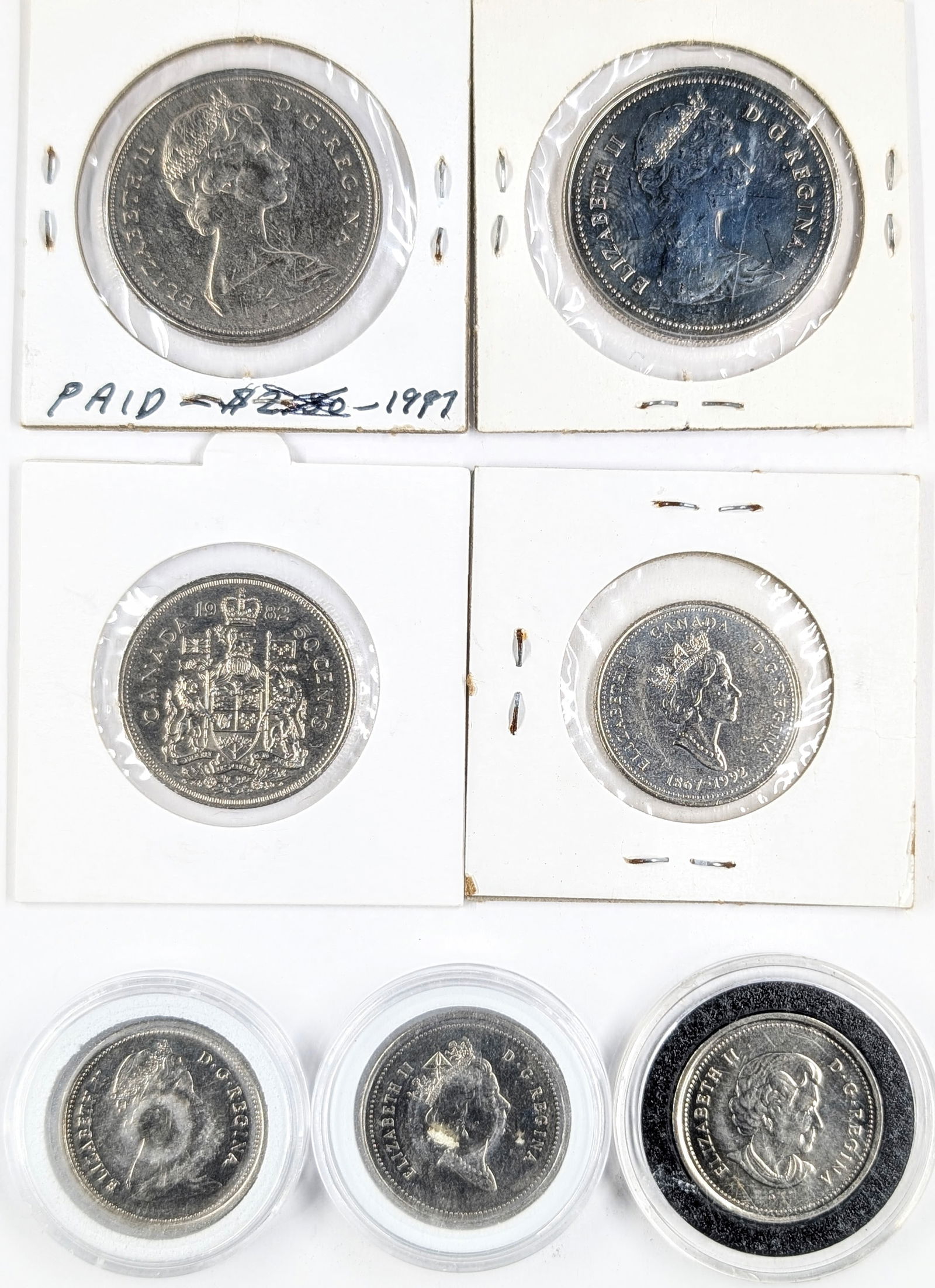 Lot of 7 Canadian Coins- One Dollar and 25 Cent Coins - 1968-2005 - 2