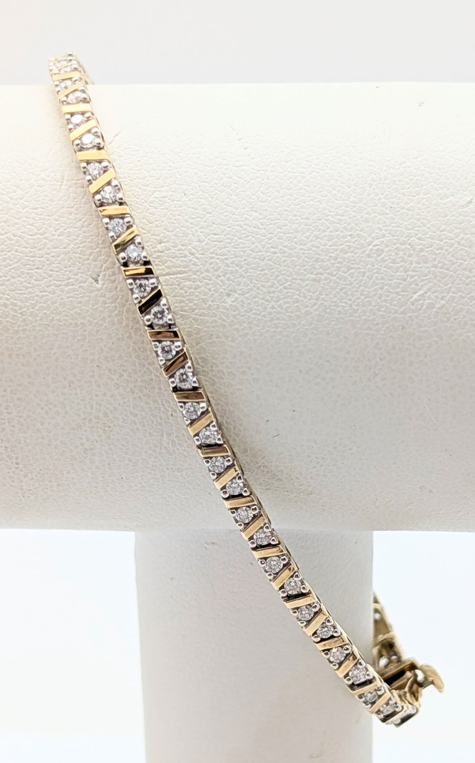 Helzberg Diamonds 10K Gold & Diamond Ladies Tennis Bracelet - 6.63g: 66 diamond chips, possibly 1/64 ct Length: 7in 